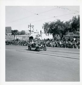 Winnipeg's 75th Anniversary parade - car with skull and crossbones labelled "Dunc Johnny"