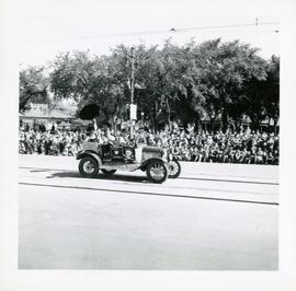 Winnipeg's 75th Anniversary parade - car with skull and crossbones labelled "Dunc Johnny"