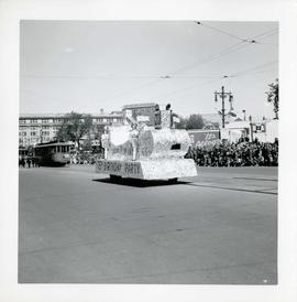 Winnipeg's 75th Anniversary parade - unknown float followed by street cars