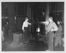 Workmen at melting furnace, Dominion Bridge Company