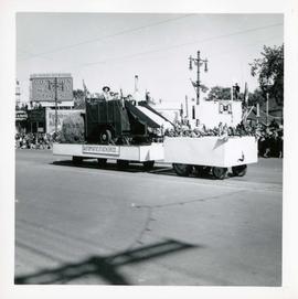 Winnipeg's 75th Anniversary parade - Automatic Stacker Company float