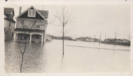 Flood water over front porch of home, 1916 Flood, Norwood