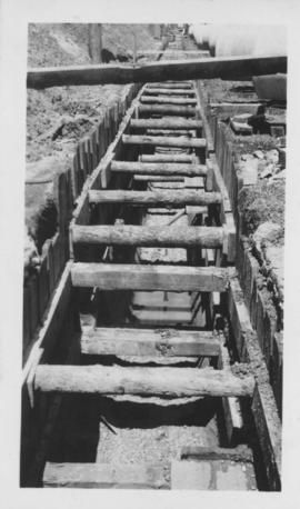 Wooden supports in trench