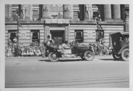 Automobile, clowns, Winnipeg's 75th Anniversary Parade