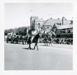 Winnipeg's 75th Anniversary parade - boy on horseback waving