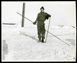 Jack Johnston holding equipment in snow
