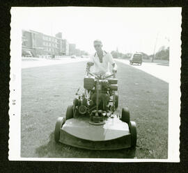 Cutting the grass on the Boulevard at Portage Avenue and Mount Royal Road