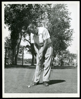 A man putting a golf ball on the Kildonan Park Golf Course