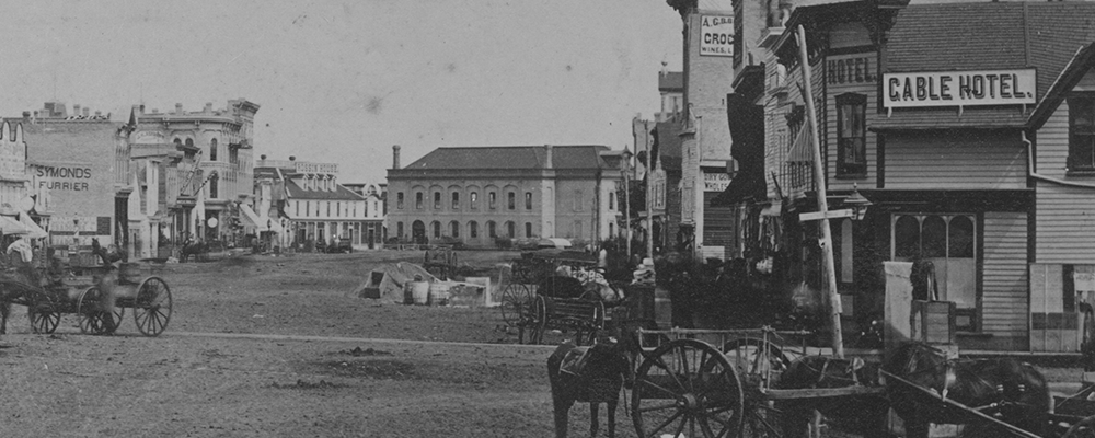 Main Street looking north towards Winnipeg's first City Hall (centre), circa 1880. City of Winnipeg Archives Photograph collection (P4 File 4).
