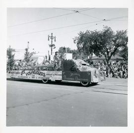 Winnipeg's 75th Anniversary parade - St. Boniface Snowshoe Club Les Voyageurs float