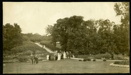 A group of people walking into the gardens at Kildonan Park