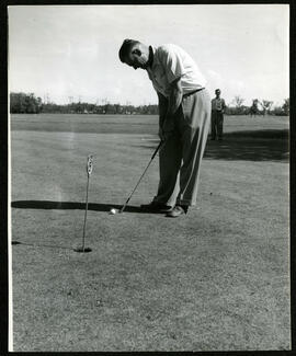 A man putting a golf ball on the Kildonan Park Golf Course